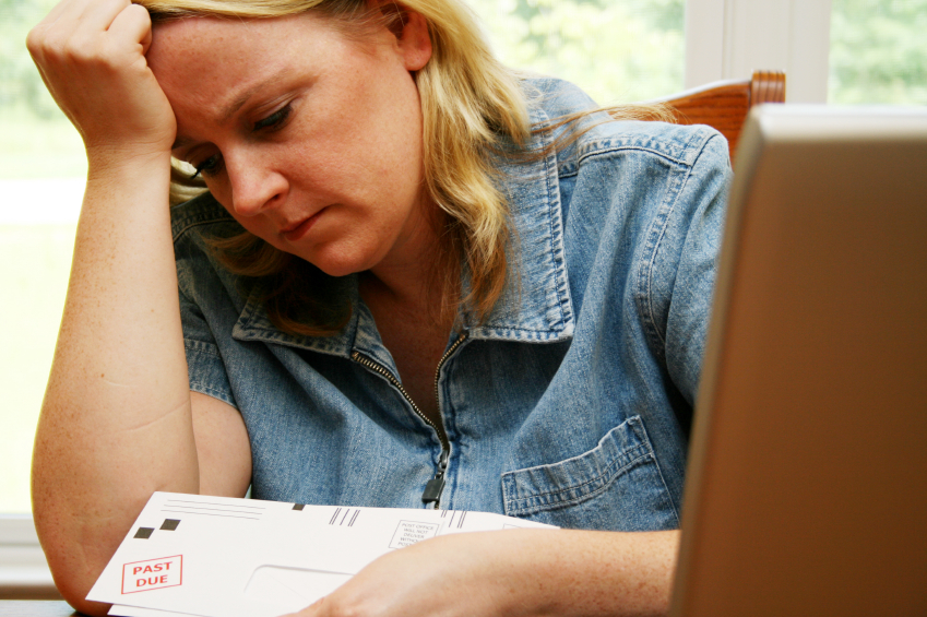 Woman pays bills at home