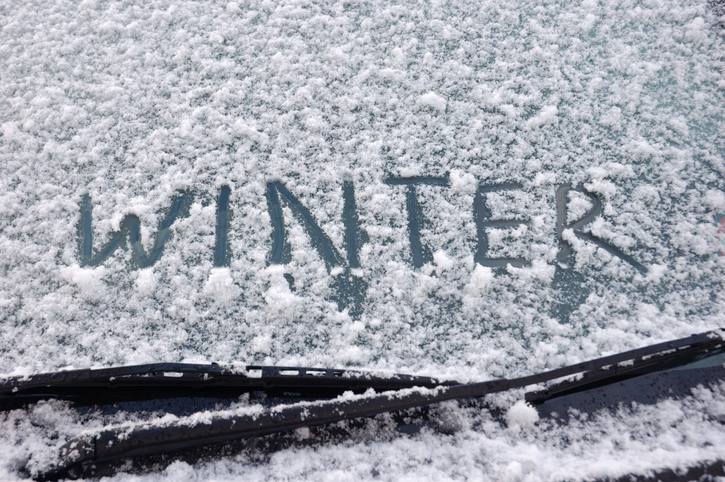 Winter written on a snow covered window