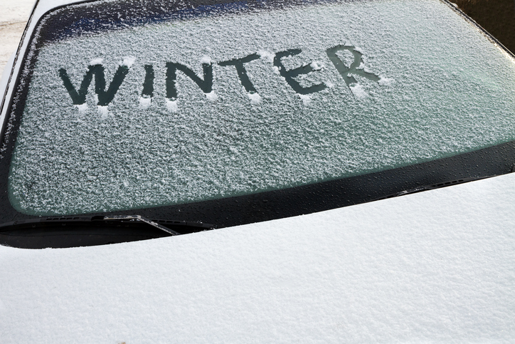 Winter written on a car's front windshield