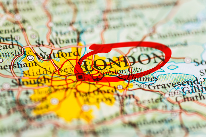 London city circled with red marker on map. Close up shot