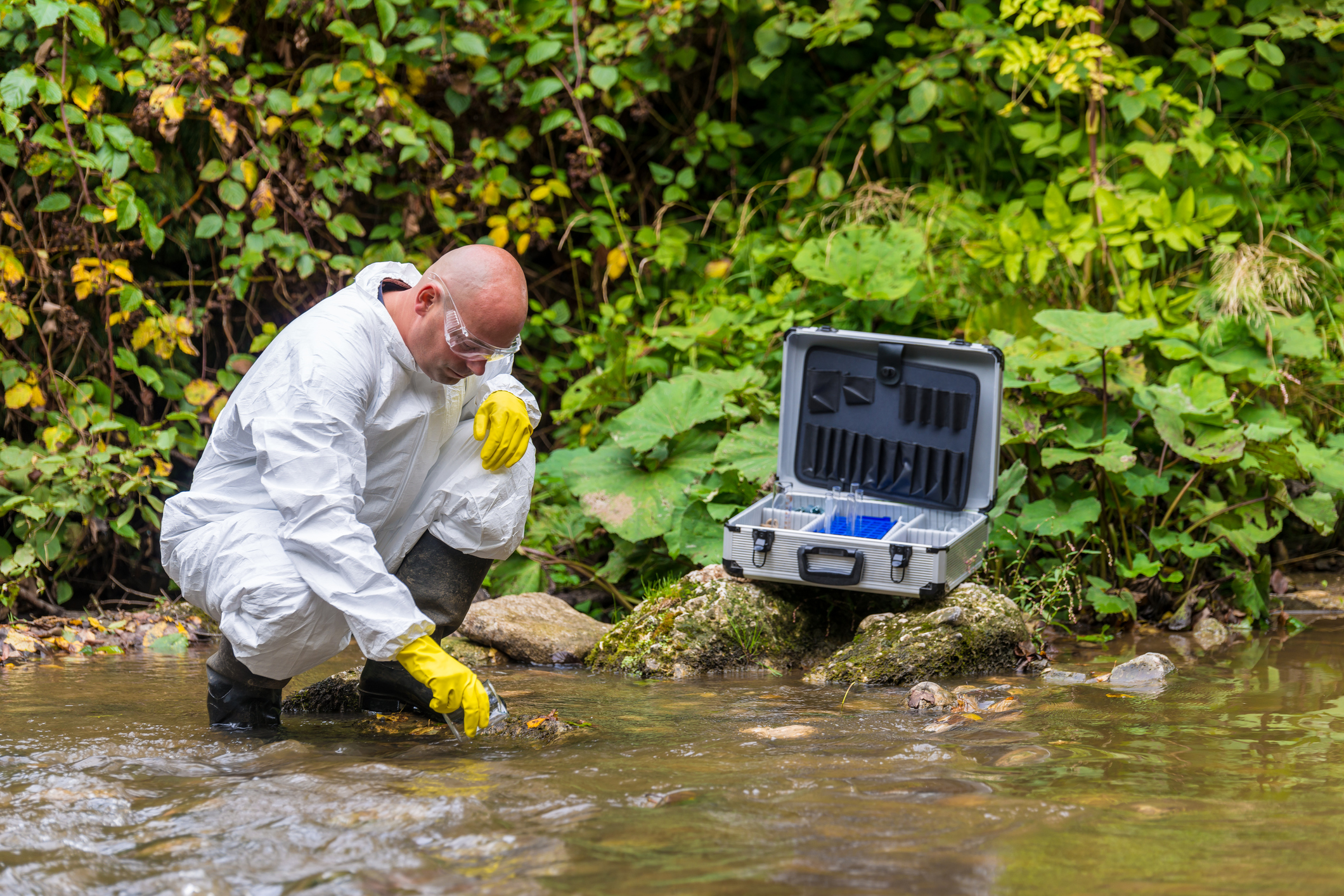 Scientist examing toxic water.