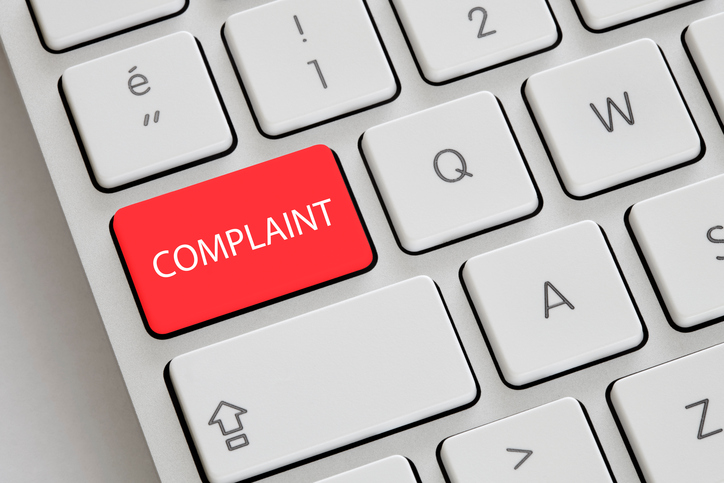 Red "Complaint" buttons a computer keyboard.