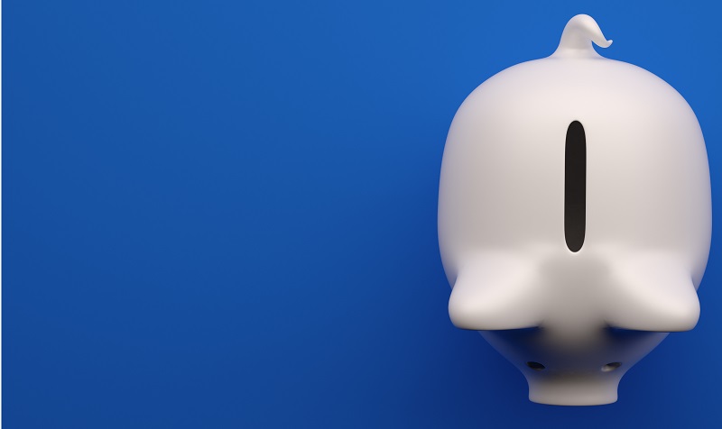 Top view of a white piggy bank on a blue background