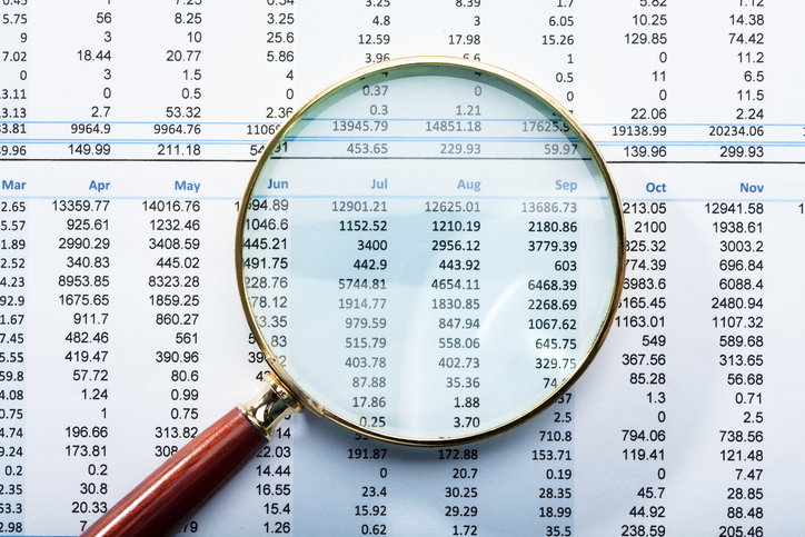 magnifying glass on financial report