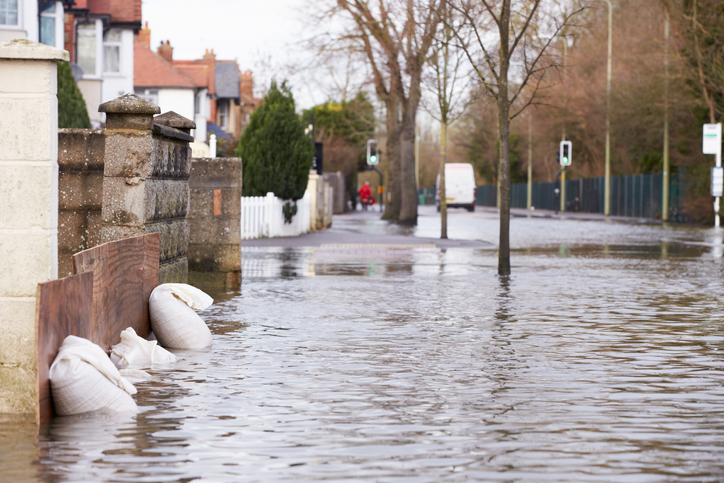 Sandbags Outside House On Flooded Road