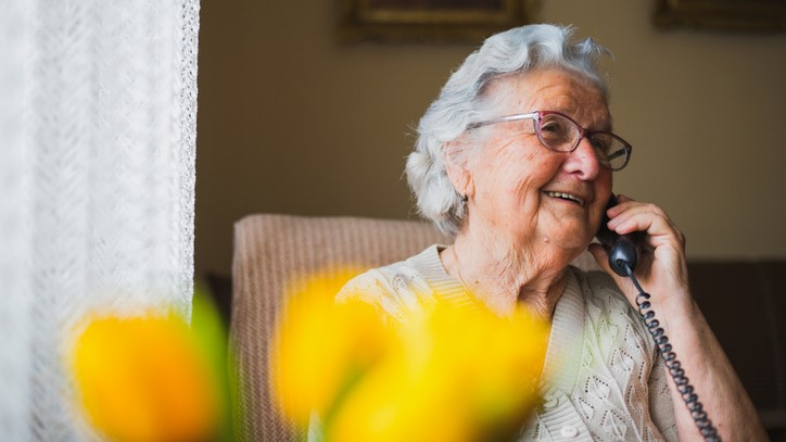 Portrait of an older woman talking with the phone