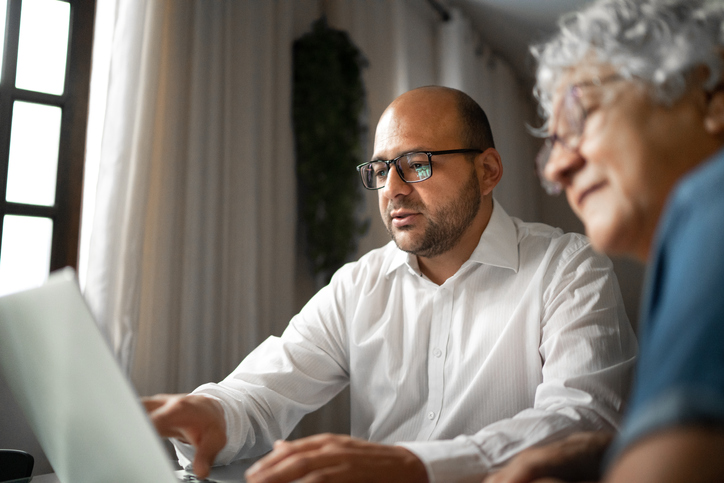 advisor helping a senior woman