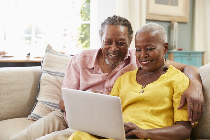 senior couple using laptop