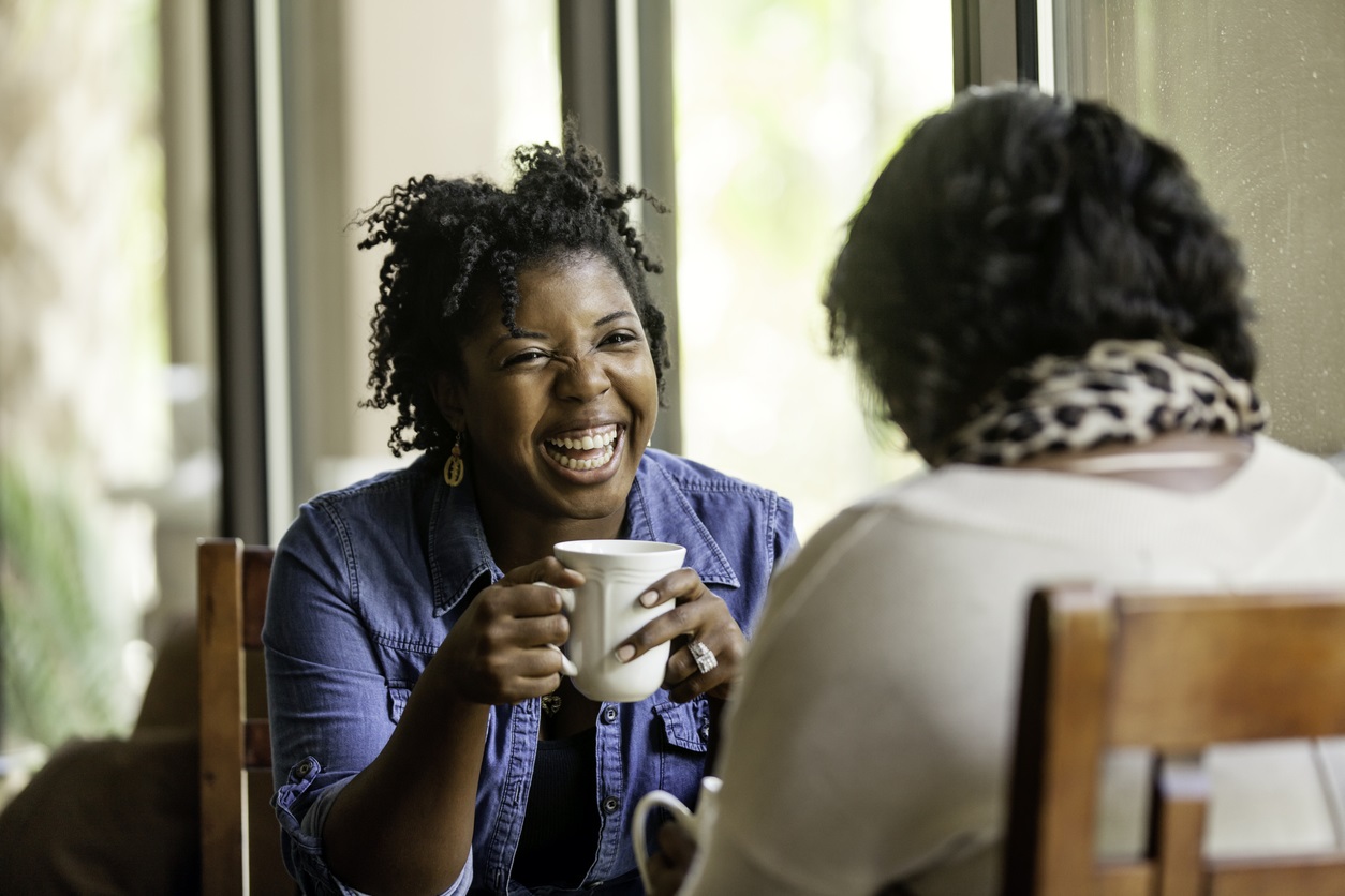 Two women having a cuppa and chat