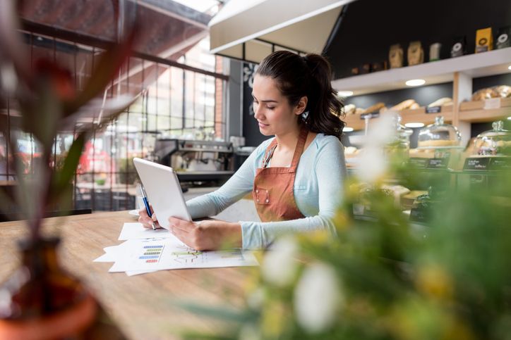 Business owner looking at company books