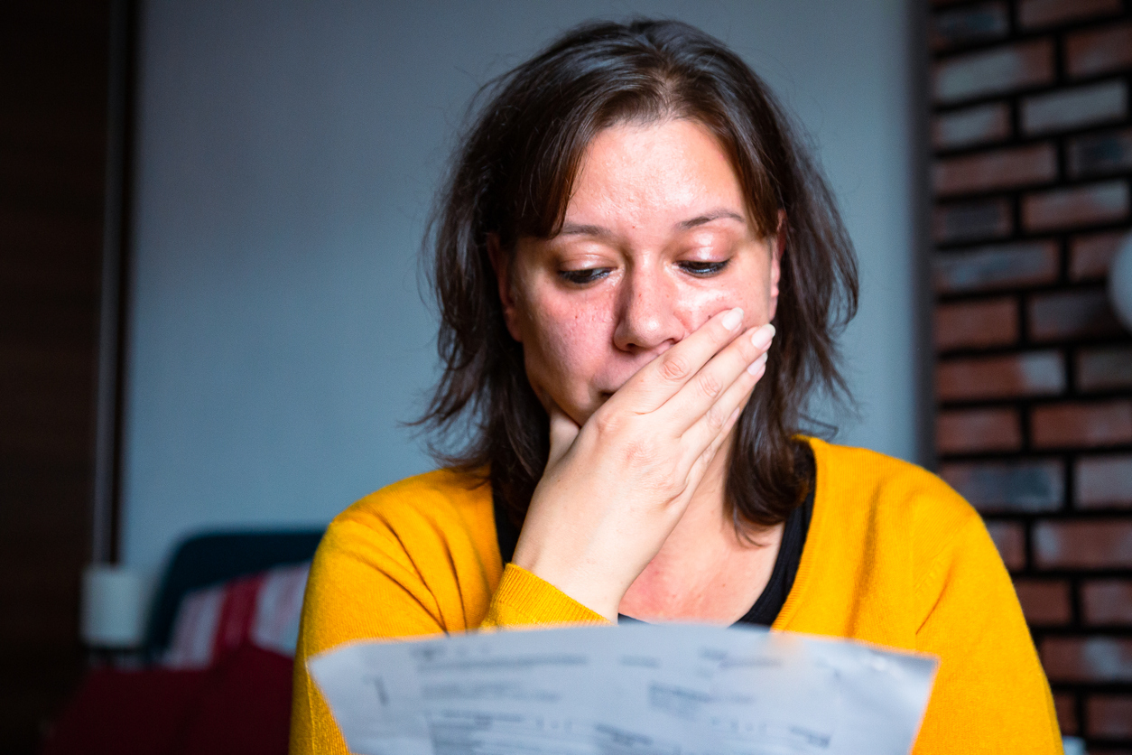 adult woman checking her bills at home,