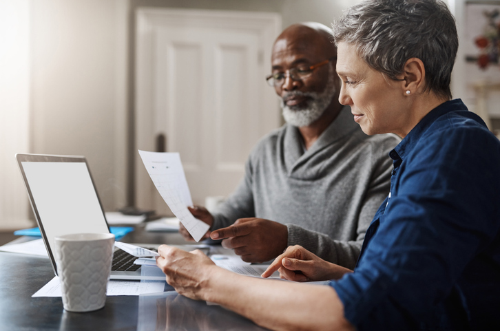 senior couple working on their finances at home