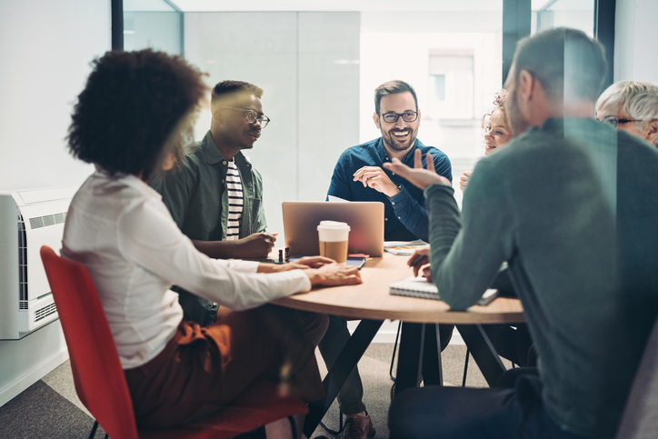 Multi-ethnic group of business persons having a meeting in the office