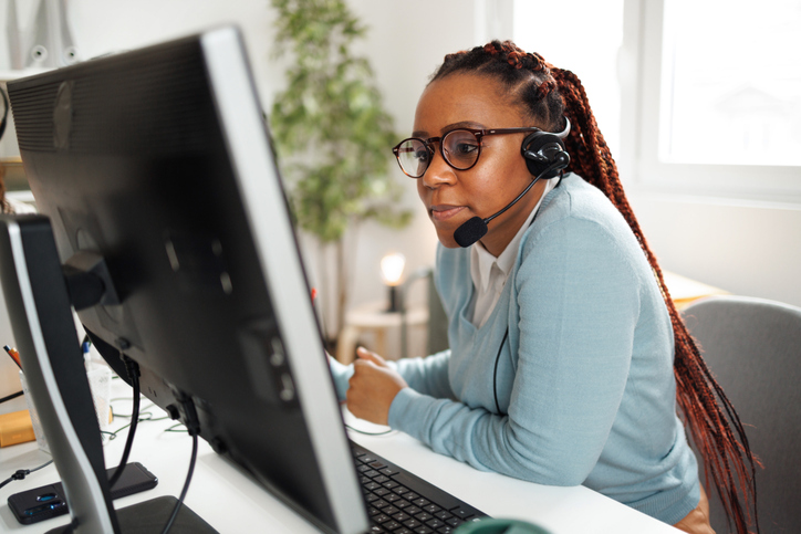 young female call center agent working in the home office