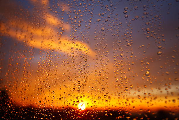 Setting sun through a rainy window